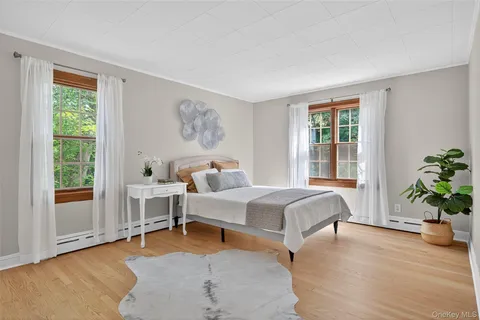 a bedroom with a large bed and a window