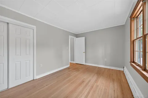 a bathroom with a sink mirror and toilet