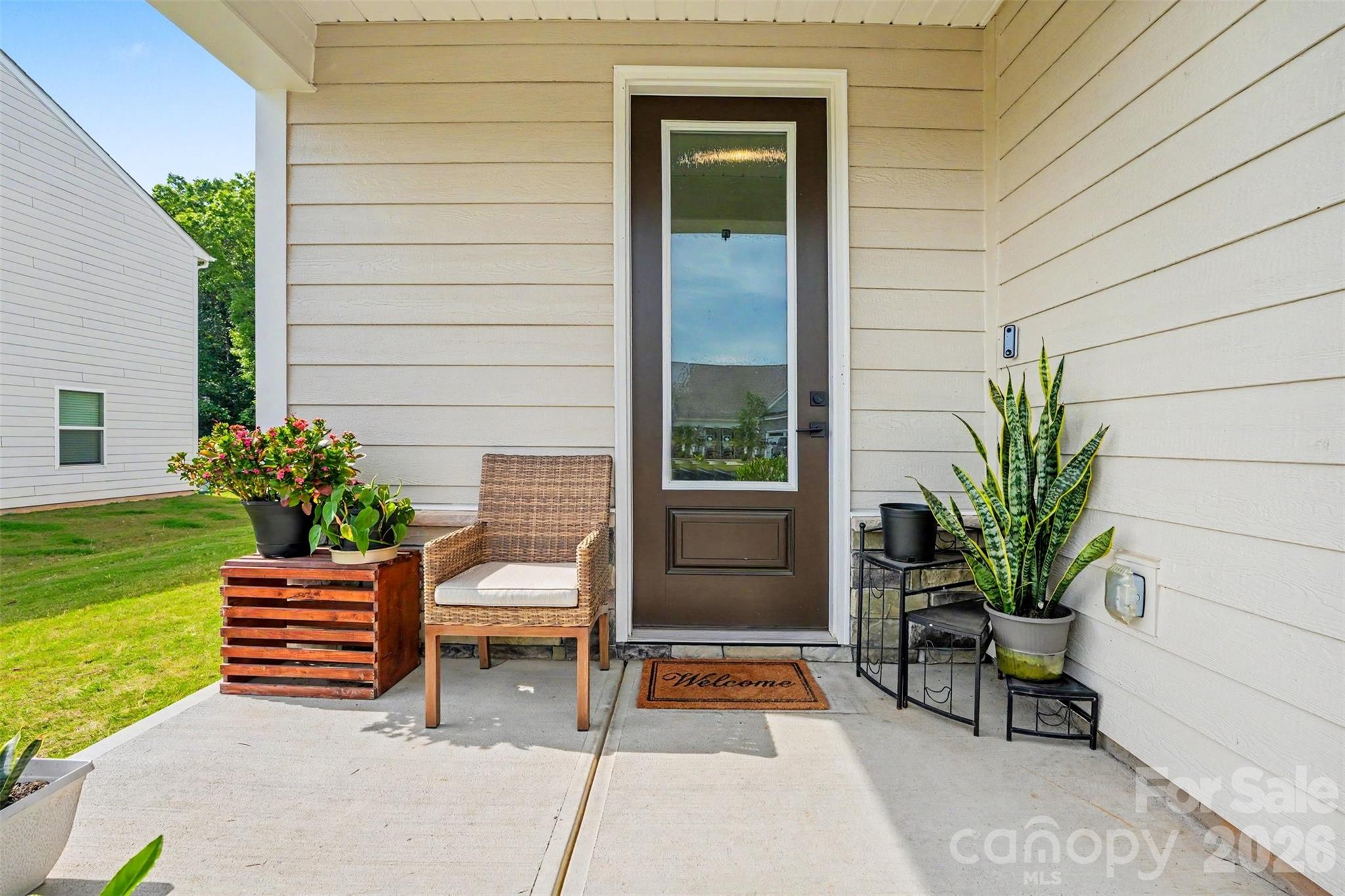123 Brixham Loop Troutman, NC 28166 - Photo 16 of 18 a house view with a garden space