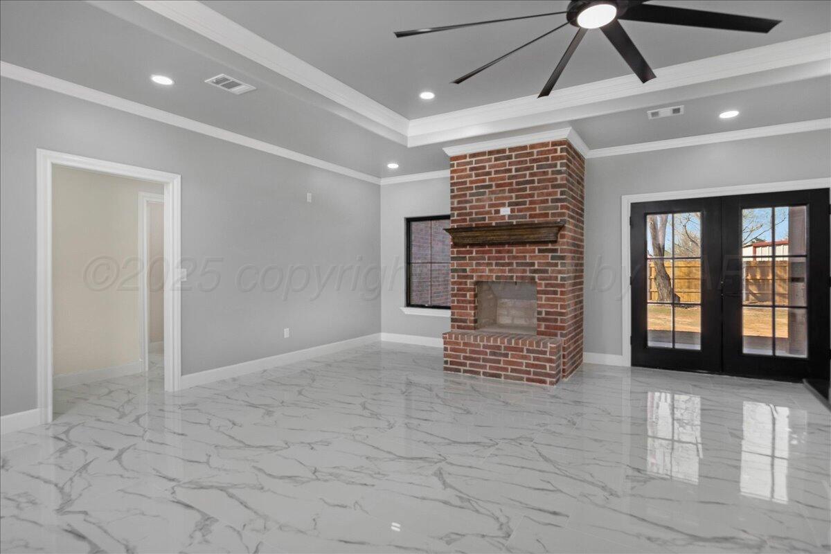 907 Oak Avenue Panhandle, TX 79068 - Photo 7 of 30 a view of an empty room with windows