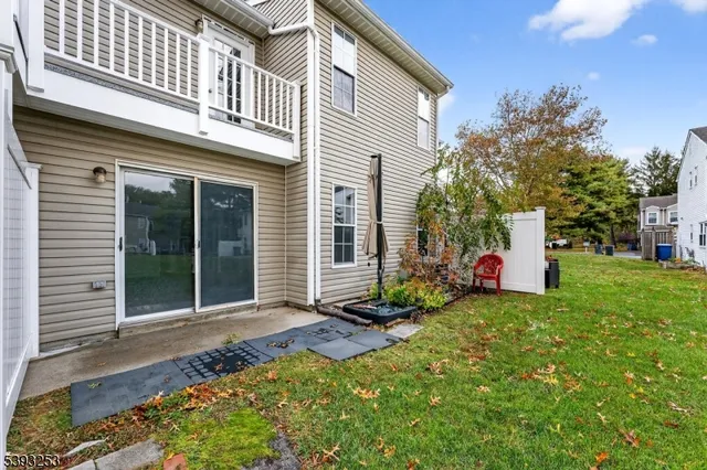 a view of a house with a yard and porch