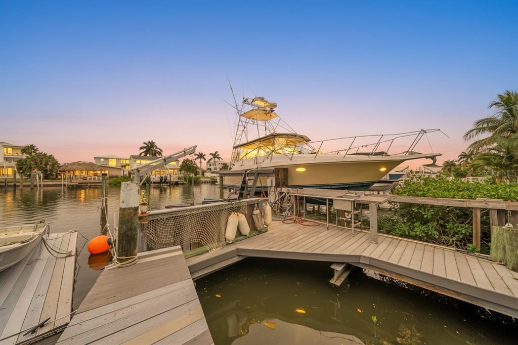 17714 Long Point Drive Redington Shores, FL 33708 - Photo 1 of 1 a view of a lake with a deck