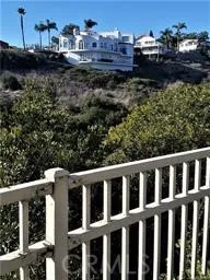 a view of a chairs and table in the back yard of the house