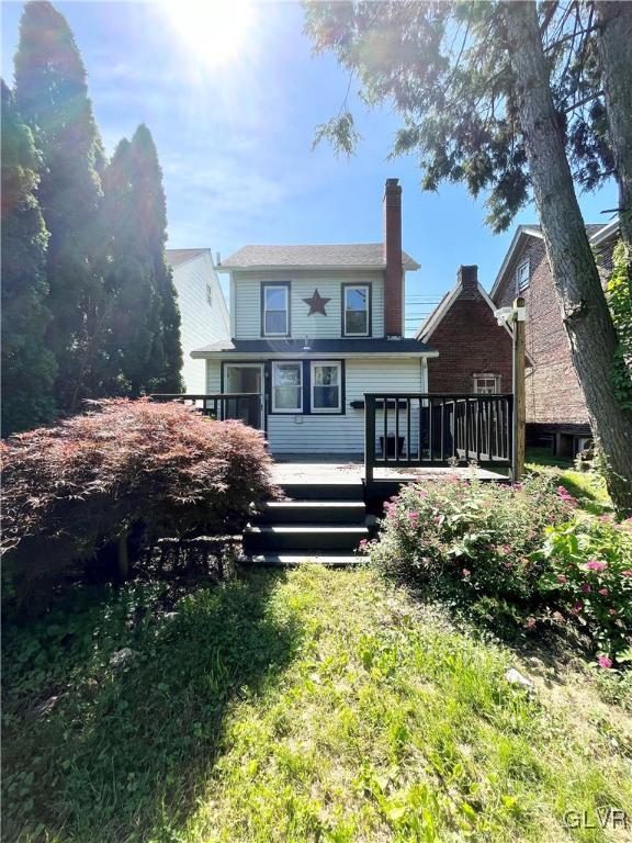 2218 Village Road Orefield, PA 18069 - Photo 17 of 28 a front view of a house with a garden
