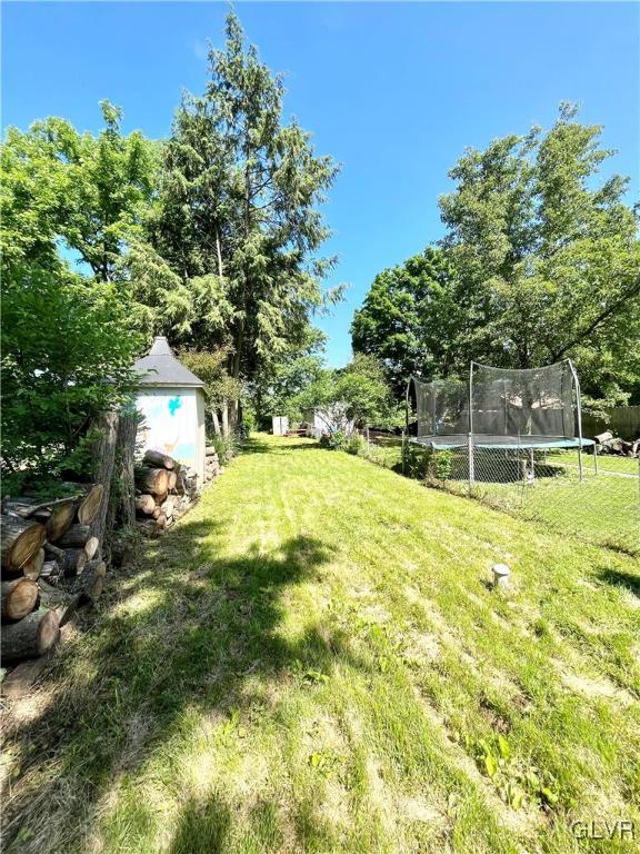 2218 Village Road Orefield, PA 18069 - Photo 18 of 28 a backyard of a house with table and chairs