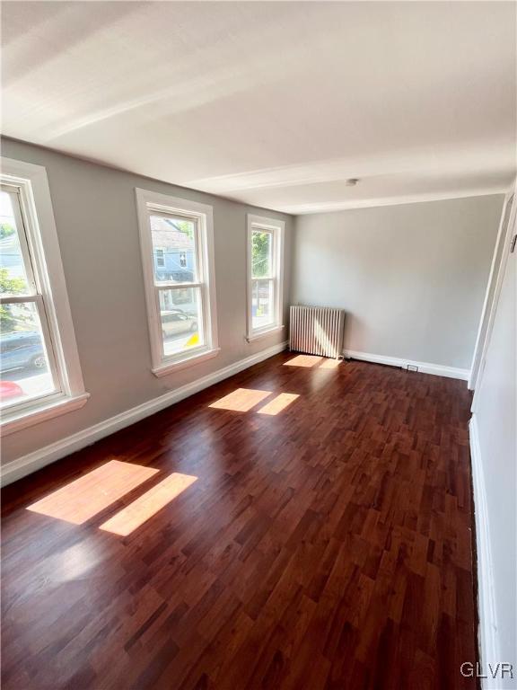 2218 Village Road Orefield, PA 18069 - Photo 23 of 28 an empty room with wooden floor and windows
