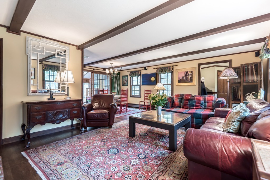 161 Raleigh Tavern Lane North Andover, MA 01845 - Photo 15 of 30 a living room with furniture and a fireplace