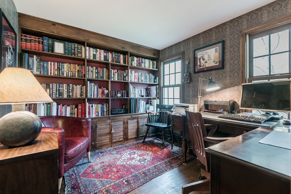 161 Raleigh Tavern Lane North Andover, MA 01845 - Photo 18 of 30 a view of a workspace with furniture and a bookshelf