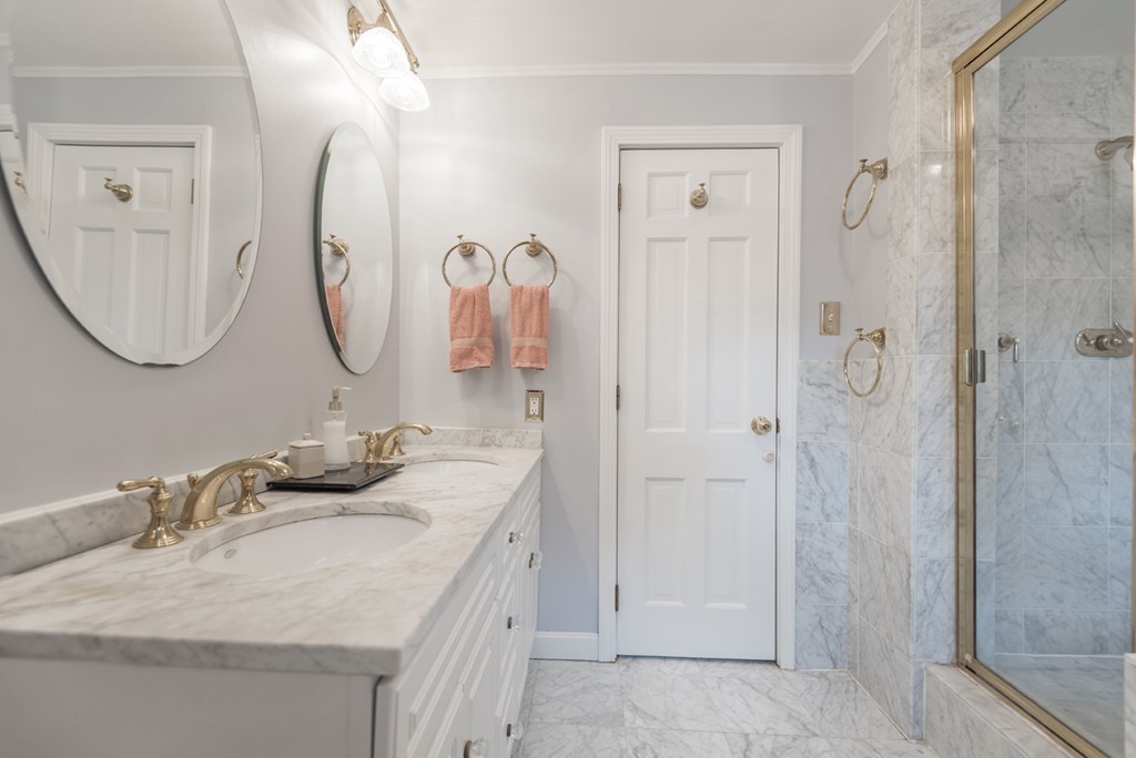 161 Raleigh Tavern Lane North Andover, MA 01845 - Photo 22 of 30 a bathroom with a granite countertop sink a mirror and a shower