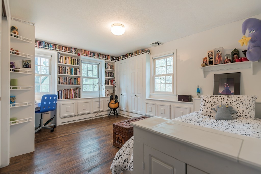 161 Raleigh Tavern Lane North Andover, MA 01845 - Photo 26 of 30 a bedroom with a bed and a chair