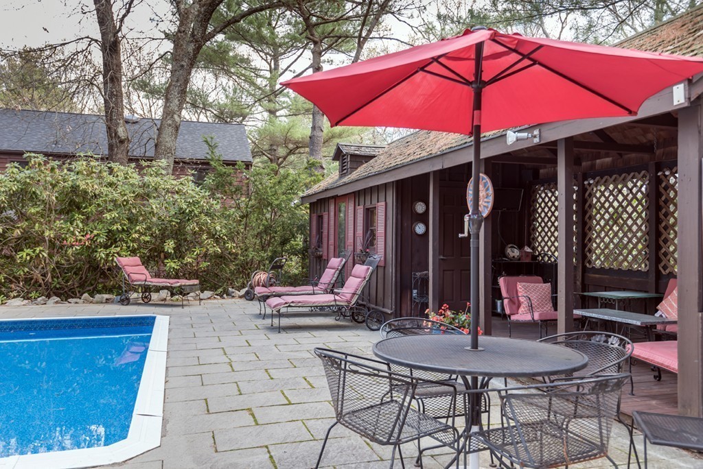 161 Raleigh Tavern Lane North Andover, MA 01845 - Photo 5 of 30 a view of patio with a table and chairs under an umbrella