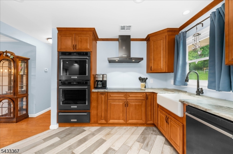 650 Woodglen Road Glen Gardner, NJ 08826 - Photo 9 of 28 a kitchen with stainless steel appliances granite countertop a refrigerator and a sink
