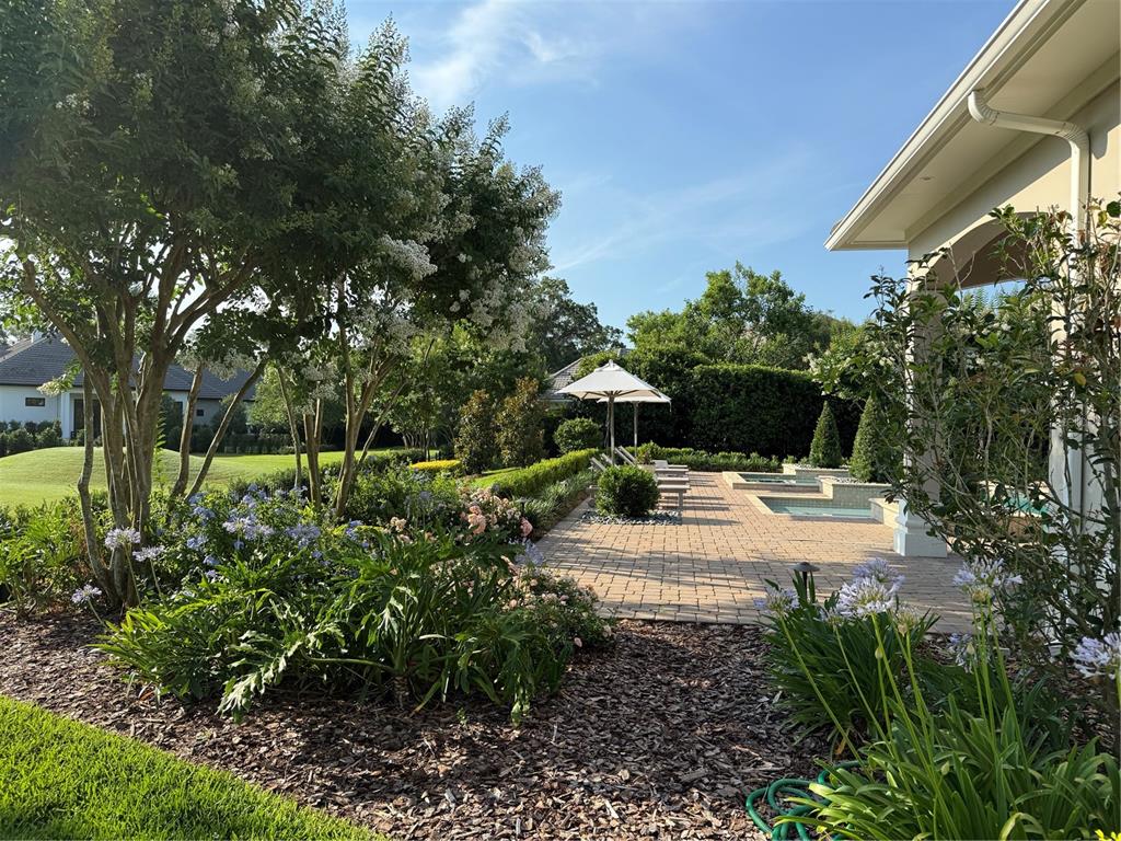8761 Northwest 31st Lane Road Ocala, FL 34482 - Photo 21 of 25 a view of a yard with plants and a fountain