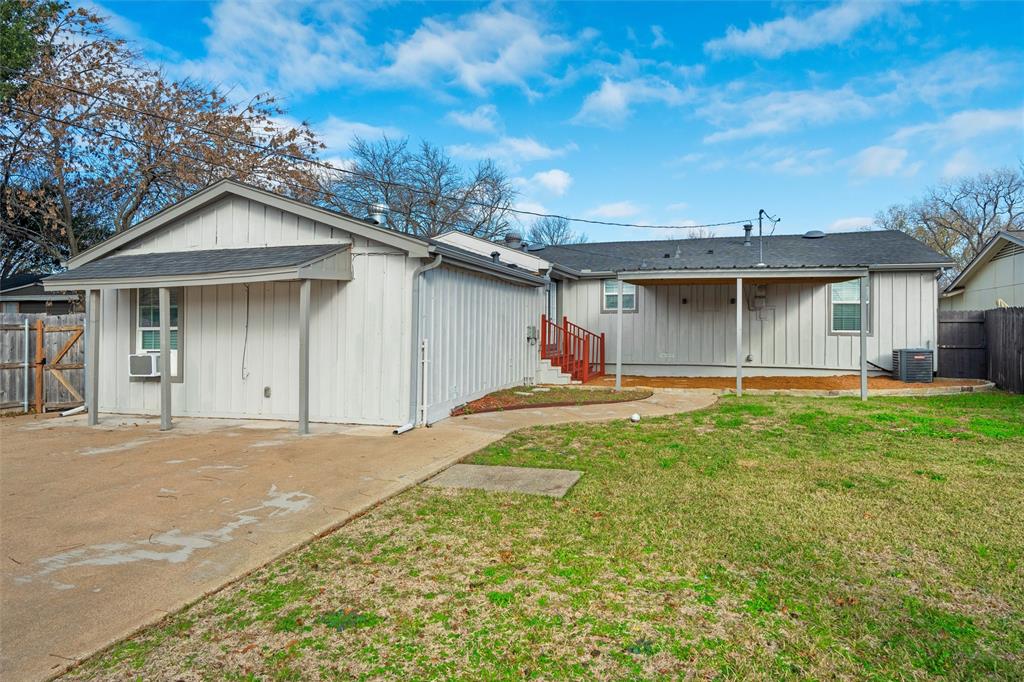3514 Larry Street Rowlett, TX 75088 - Photo 25 of 27 a view of a house with a yard