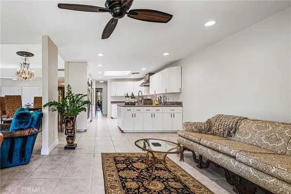 a kitchen with stainless steel appliances granite countertop a stove and cabinets