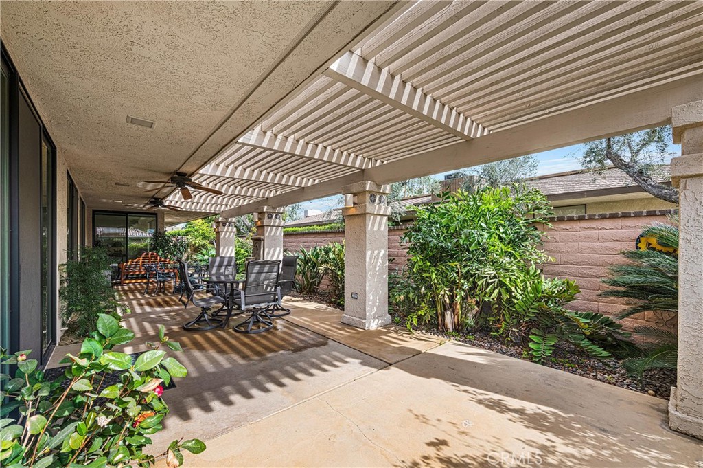 19 Cornell Drive Rancho Mirage, CA 92270 - Photo 22 of 52 a view of a patio with plants and chairs