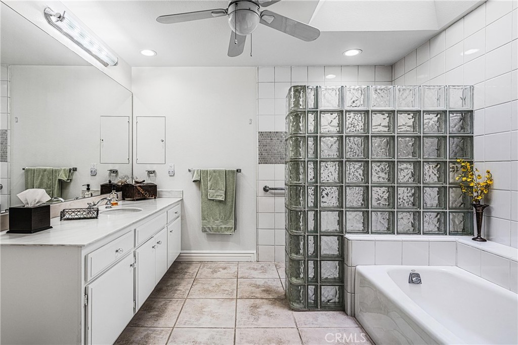 19 Cornell Drive Rancho Mirage, CA 92270 - Photo 36 of 52 a bathroom with a tub sink and mirror