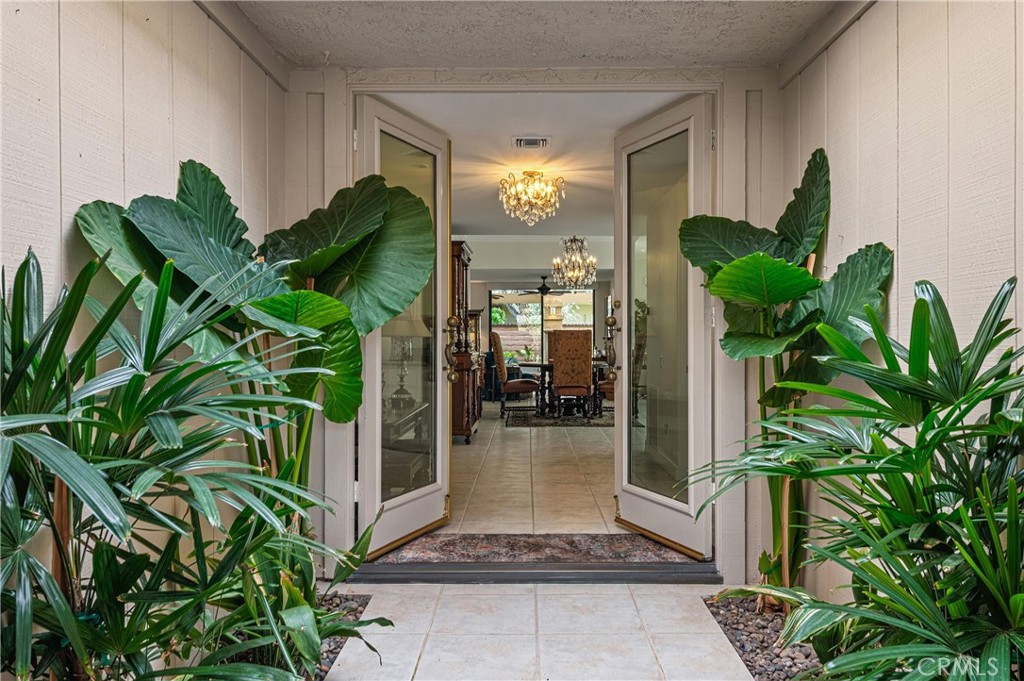 19 Cornell Drive Rancho Mirage, CA 92270 - Photo 4 of 52 a potted plant sitting in front of a house