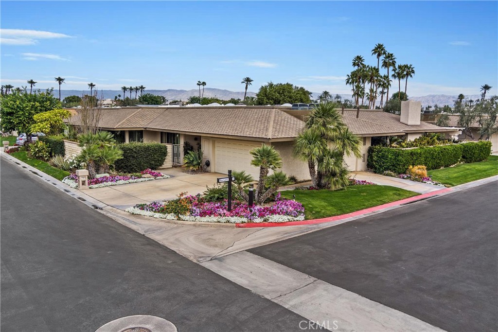 19 Cornell Drive Rancho Mirage, CA 92270 - Photo 52 of 52 a front view of a house with yellow lighting