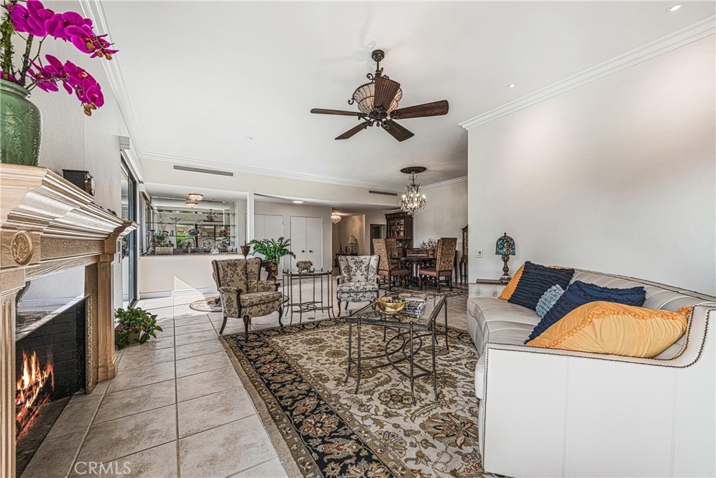 19 Cornell Drive Rancho Mirage, CA 92270 - Photo 7 of 52 a living room with furniture and a fireplace
