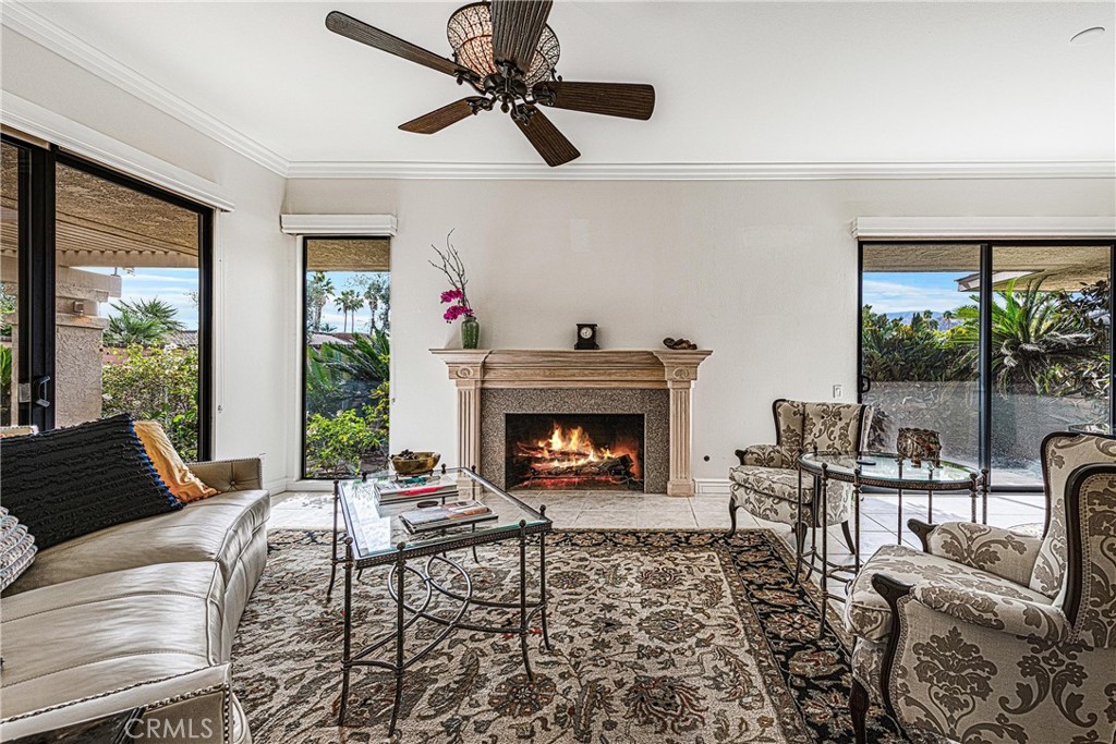 19 Cornell Drive Rancho Mirage, CA 92270 - Photo 8 of 52 a living room with furniture and a fireplace