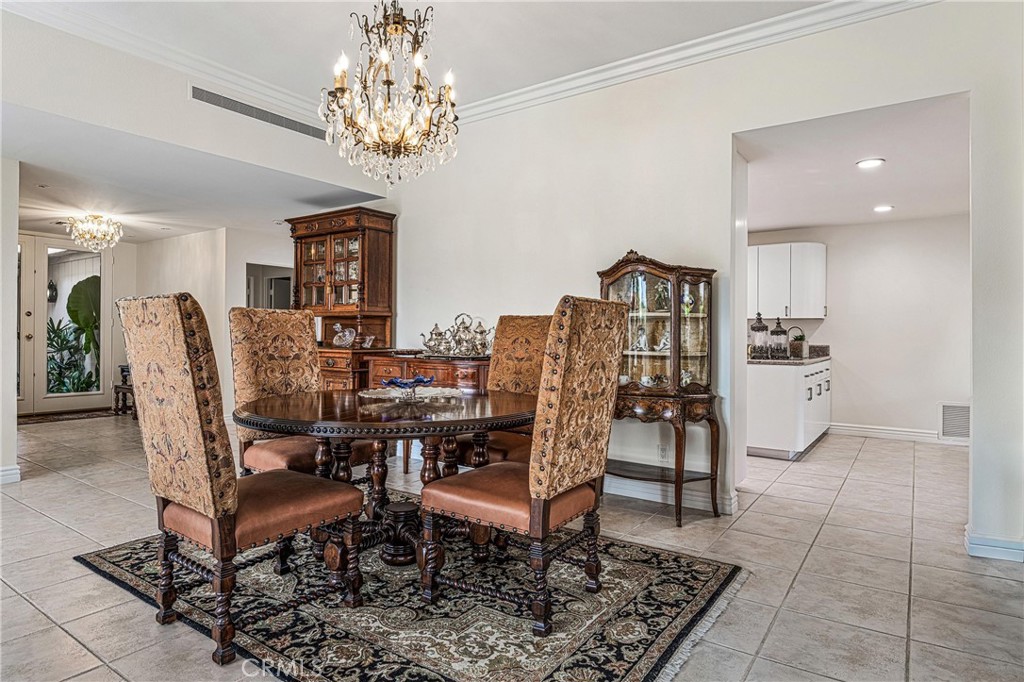 19 Cornell Drive Rancho Mirage, CA 92270 - Photo 10 of 52 a view of a dining room with furniture