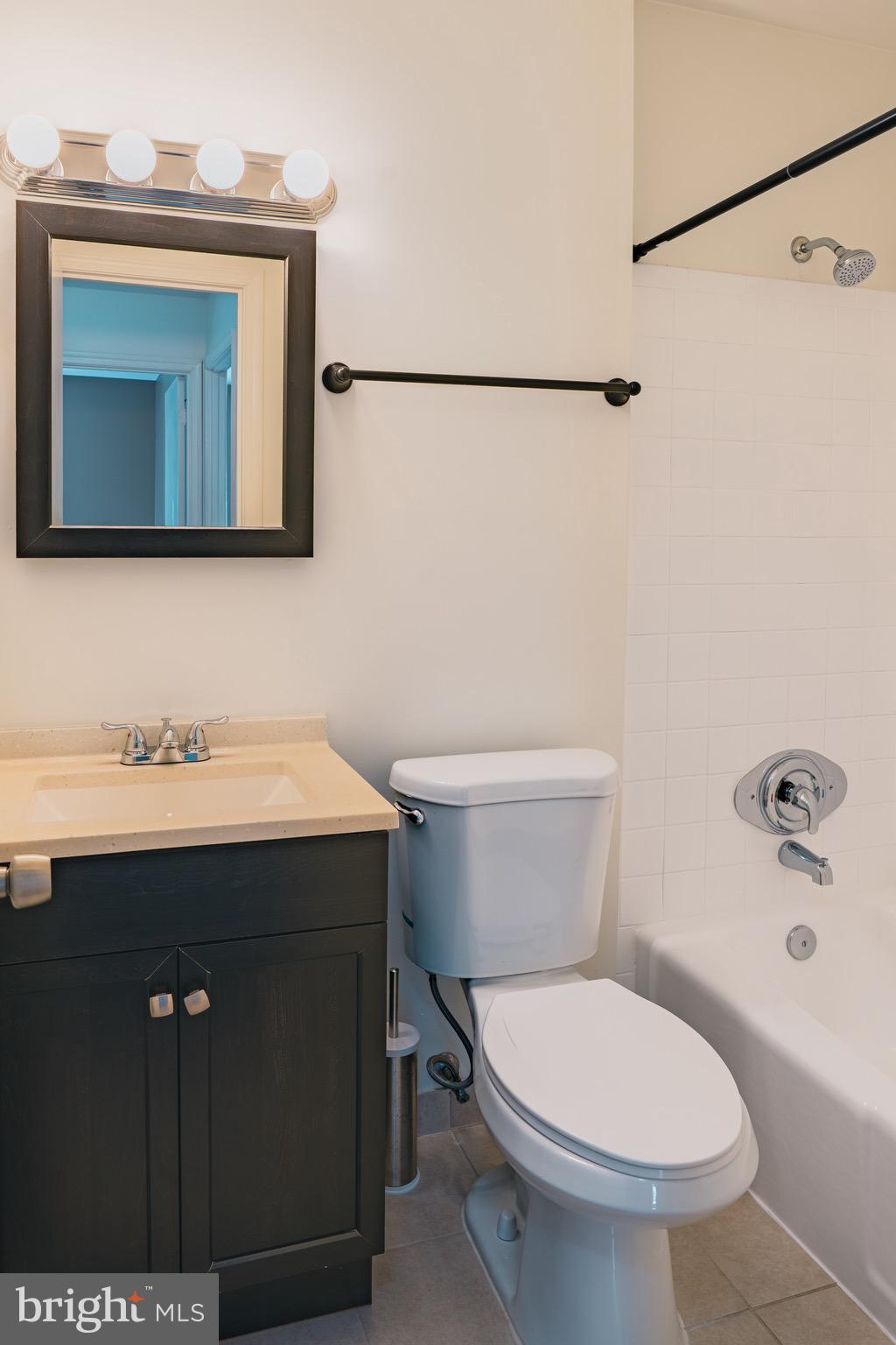 2913 Seminole Road Woodbridge, VA 22192 - Photo 23 of 34 a bathroom with a toilet sink and mirror