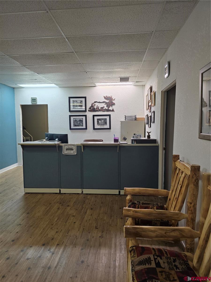 422 Fourth Street Alamosa, CO 81101 - Photo 5 of 15 a view of kitchen with furniture and wooden floor