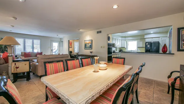 a view of a dining room with furniture and a large window