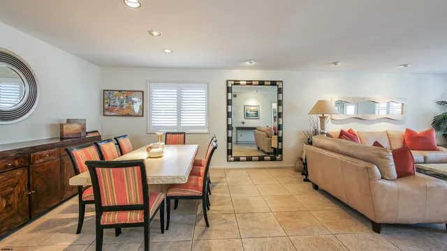 a view of a dining room with furniture and window