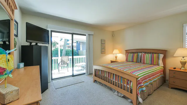 a bedroom with a bed and a tv in it