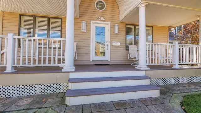 a front view of a house with a porch