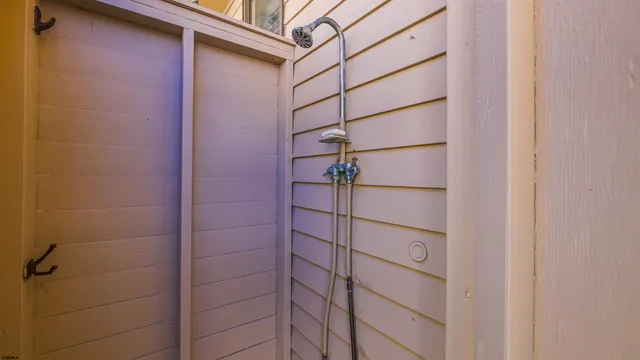 a view of a room with shelf on the wall