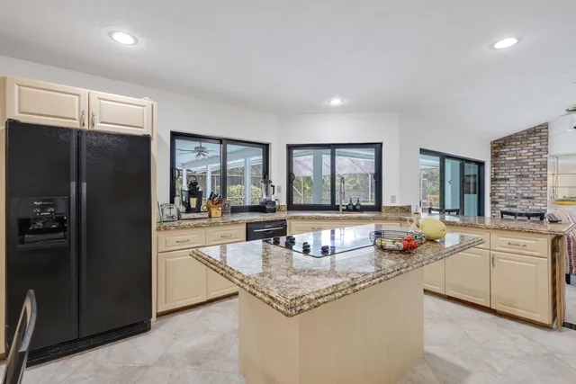 a spacious bathroom with a granite countertop sink mirror and double