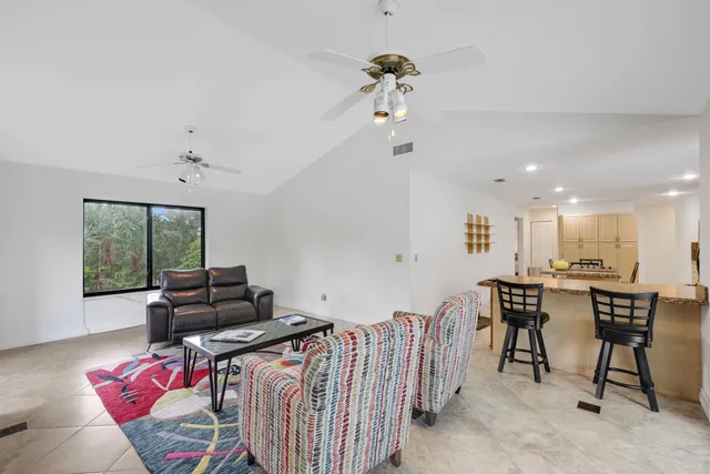 a living room with furniture fireplace and a flat screen tv
