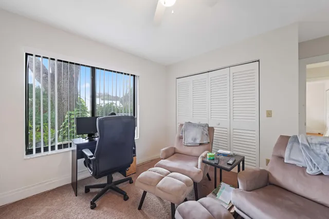 a view of a swimming pool with a table and chairs