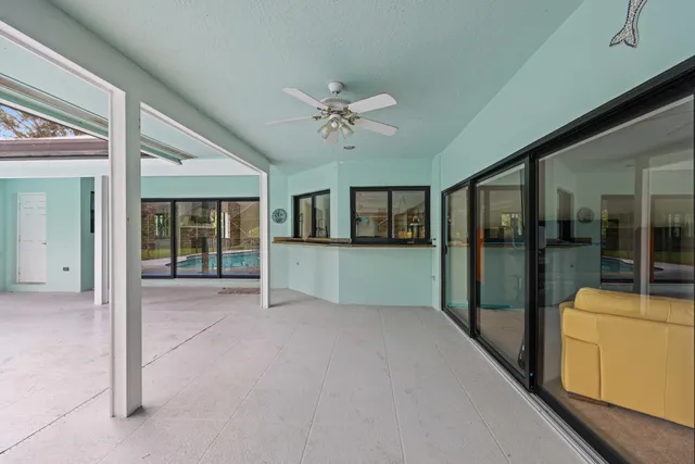 a view of a swimming pool with a patio