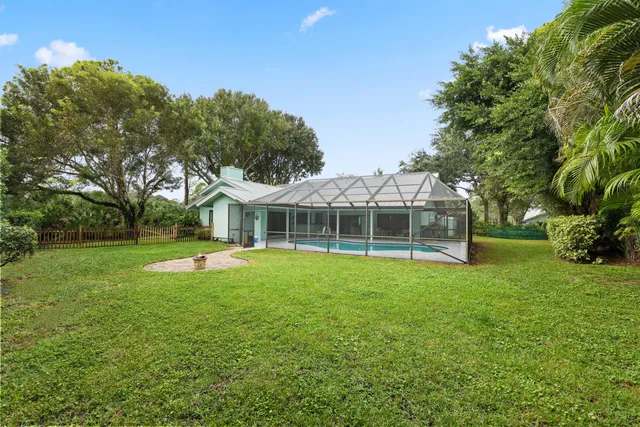 a front view of a house with a yard and a garage