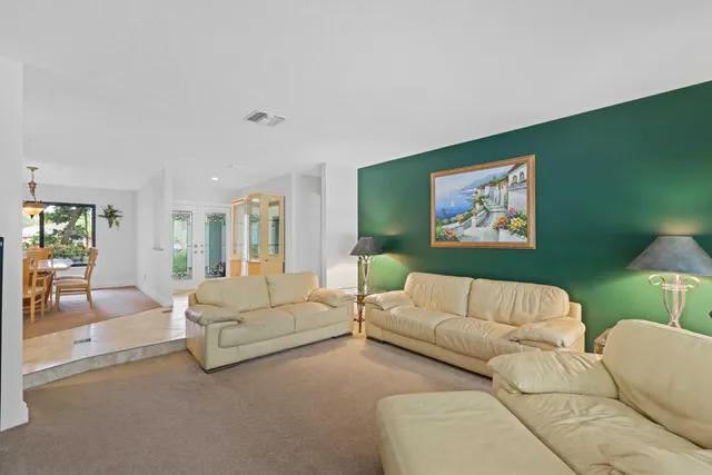 a living room with a couch and a flat screen tv