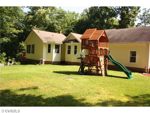 12103 Chatham Road Prince George, VA 23875 - Photo 16 of 18 Land/Lot - Rear of house and pic of playset that will remain with home if desired.