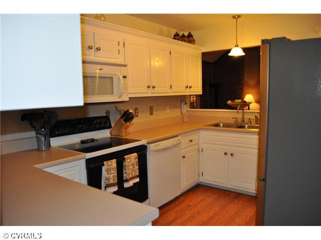 12103 Chatham Road Prince George, VA 23875 - Photo 3 of 18 Exterior Front - Kitchen - open to living room - with stainless refrigerator conveying.