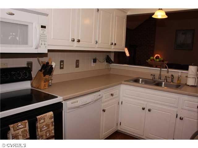 12103 Chatham Road Prince George, VA 23875 - Photo 4 of 18 Kitchen - Also updated hardware, fixtures and white custom cabinets.