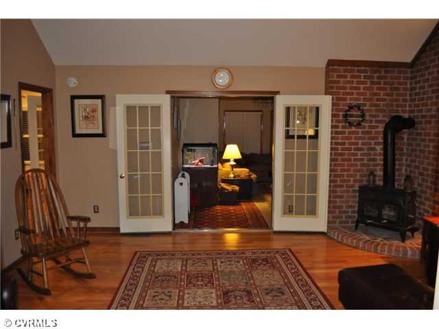12103 Chatham Road Prince George, VA 23875 - Photo 5 of 18 Living Room - Living room view to Florida room.
