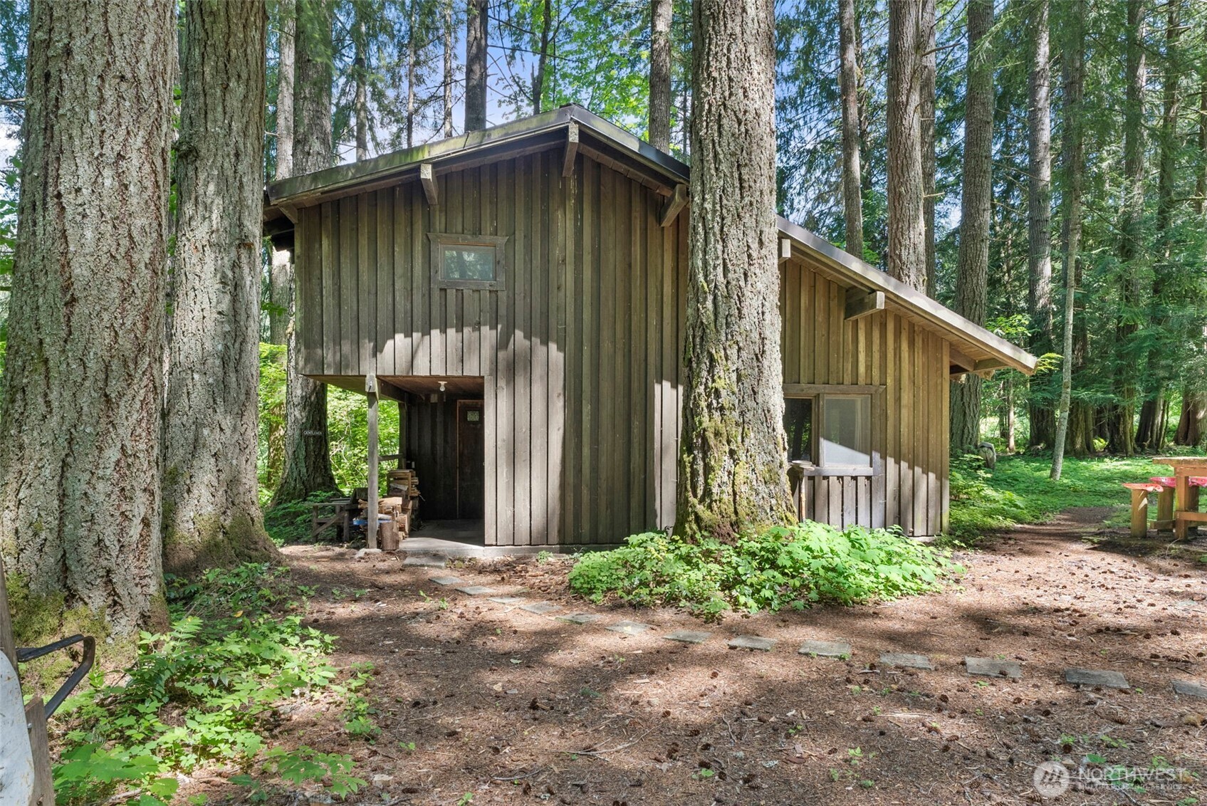 155 Bonell Road Randle, WA 98377 - Photo 10 of 38 a front view of a house with garden