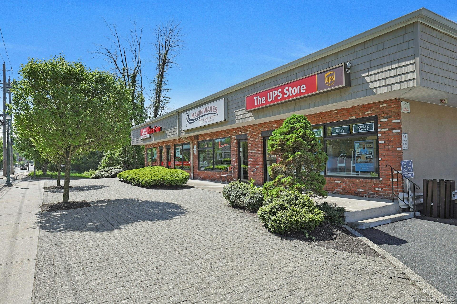 962 Rte 9W, Unit 106 Congers, NY 10920 - Photo 46 of 48 a view of a building with garden and large trees