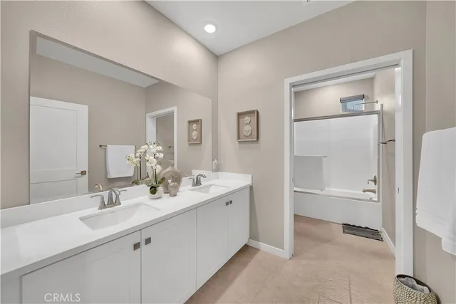 a bathroom with a double vanity sink mirror and double