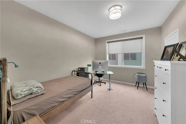 a bedroom with a bed and furniture