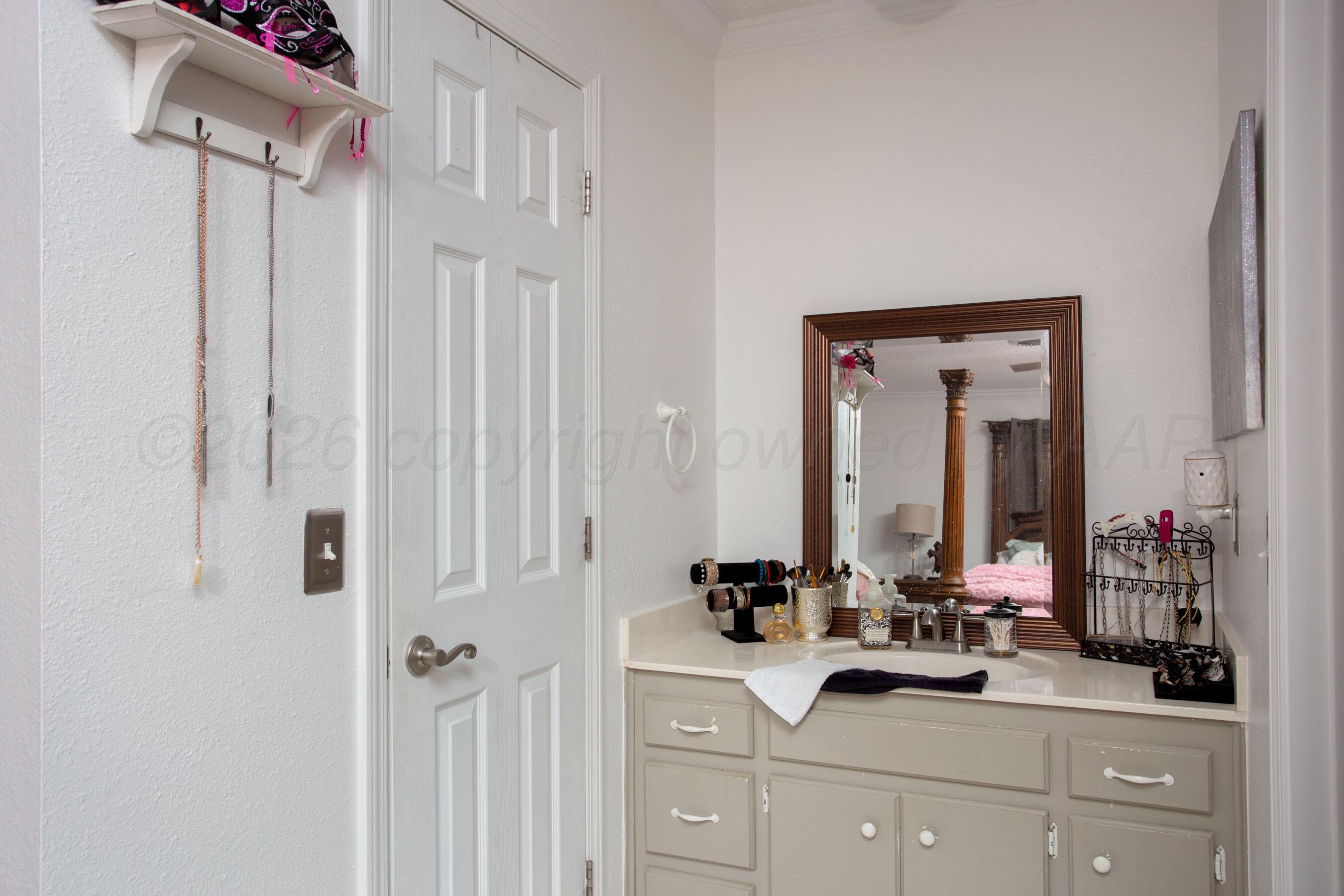 2907 Mable Drive Canyon, TX 79015 - Photo 15 of 23 a bathroom with a double vanity sink and a mirror