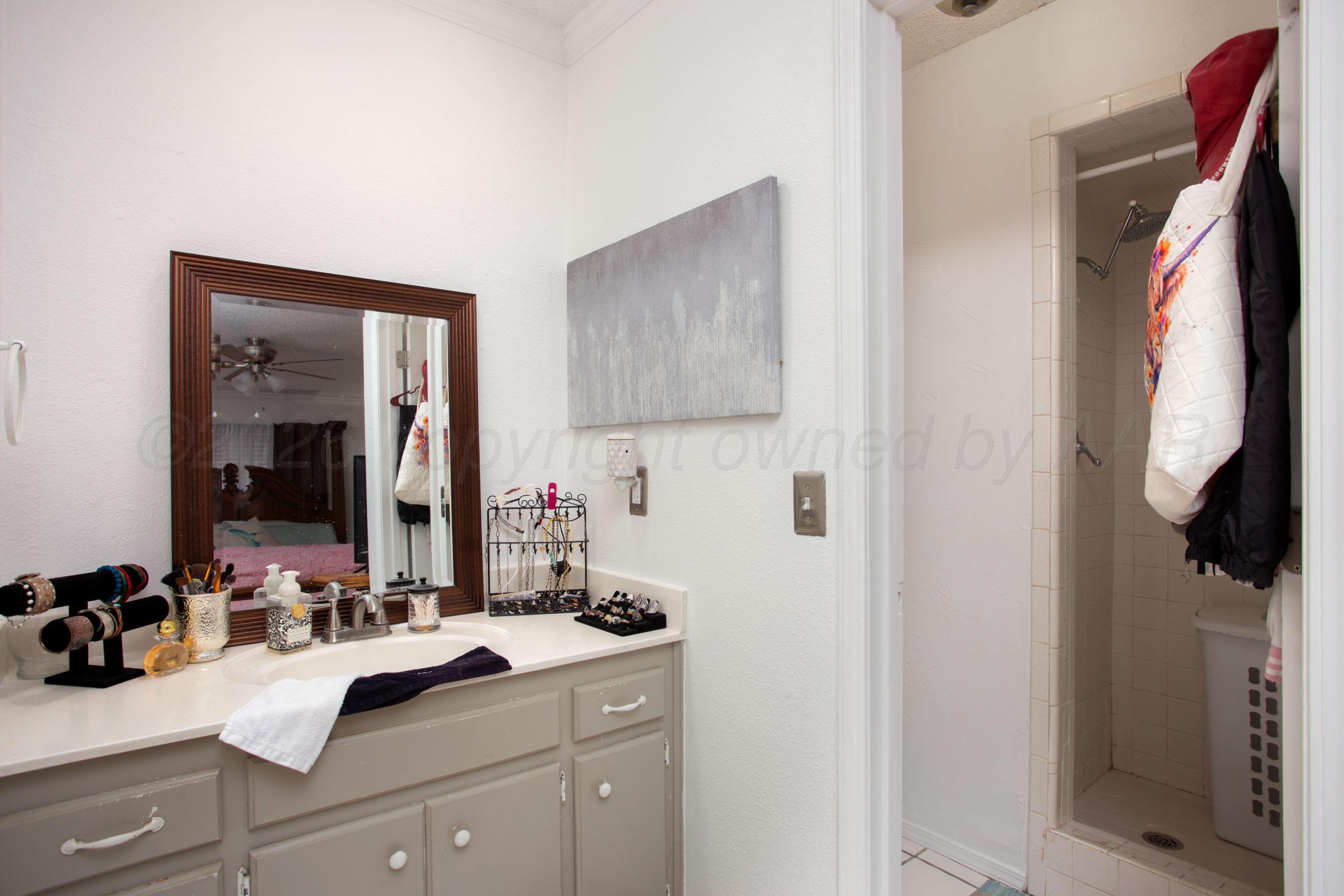 2907 Mable Drive Canyon, TX 79015 - Photo 17 of 23 a bathroom with a sink and a mirror