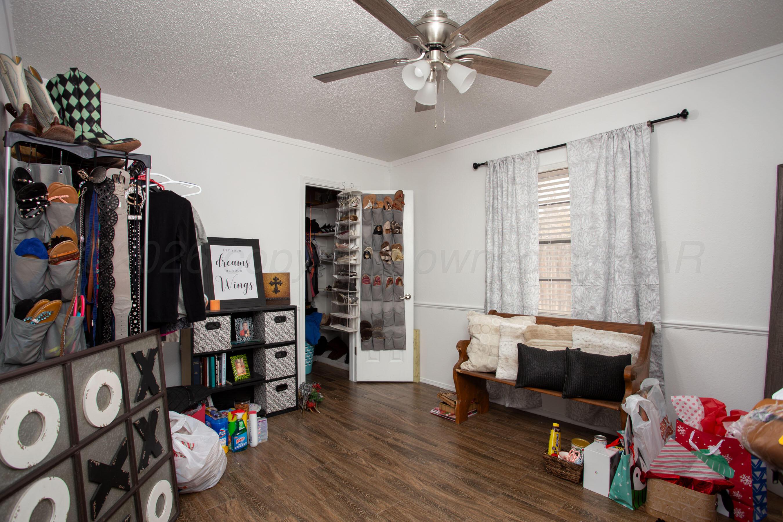 2907 Mable Drive Canyon, TX 79015 - Photo 18 of 23 a living room with lots of furniture and book shelf